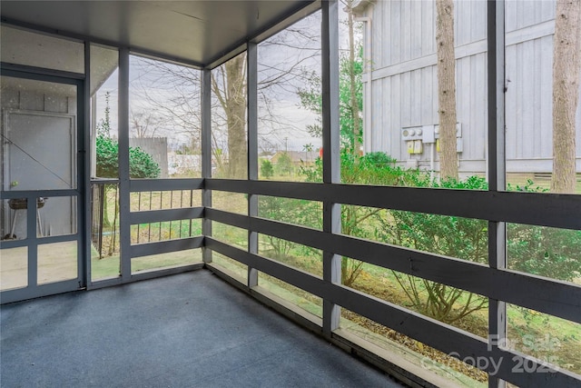 unfurnished sunroom with a wealth of natural light