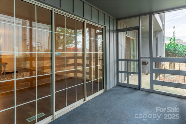 unfurnished sunroom featuring a healthy amount of sunlight