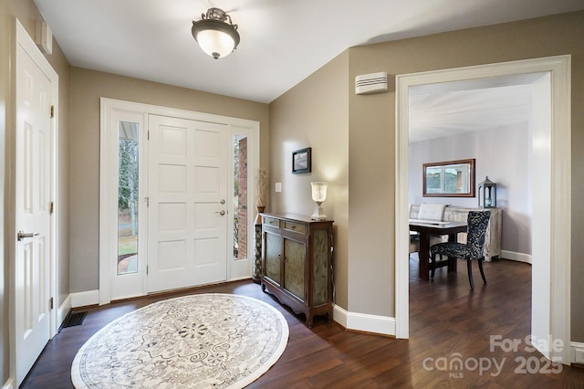 foyer entrance featuring dark hardwood / wood-style floors