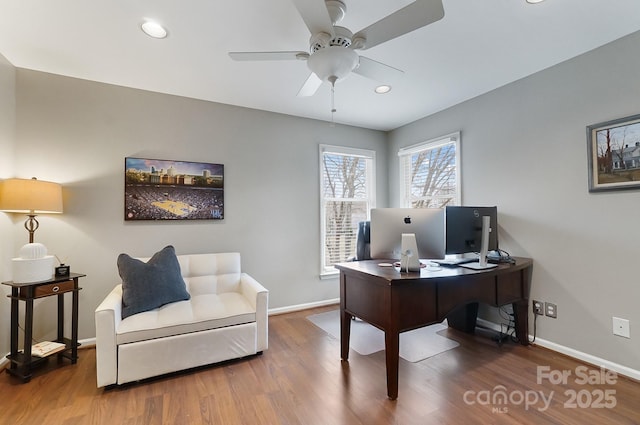 office with ceiling fan and hardwood / wood-style floors