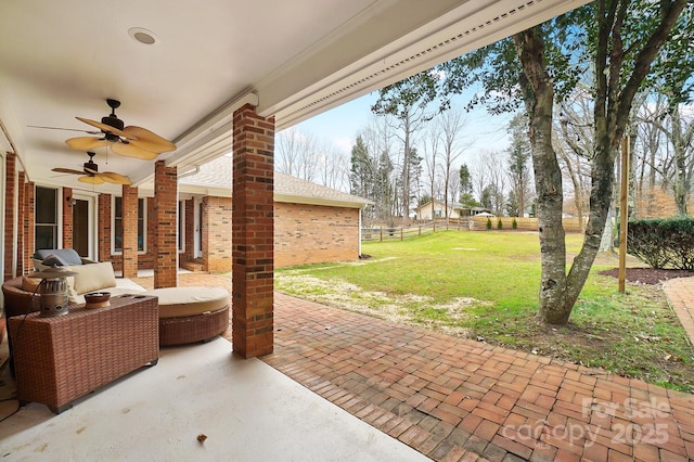 view of patio / terrace featuring ceiling fan