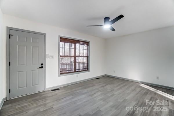 entryway featuring ceiling fan and light hardwood / wood-style floors