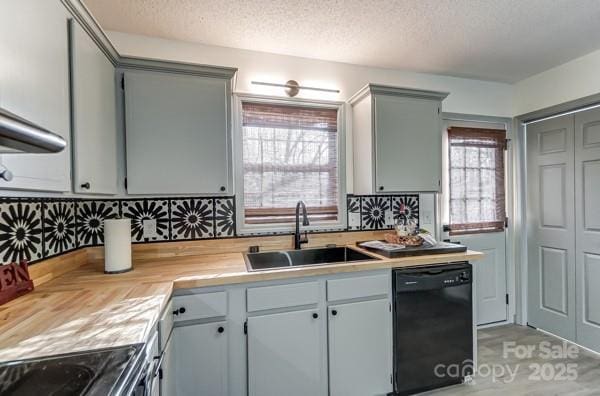 kitchen featuring sink, gray cabinetry, tasteful backsplash, black dishwasher, and electric stove