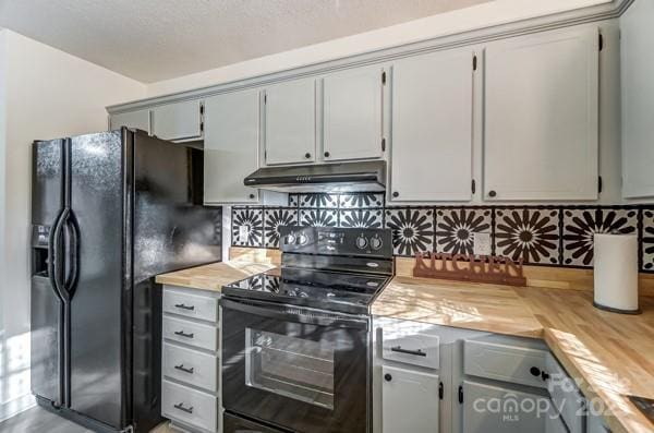 kitchen with gray cabinetry, wooden counters, and black appliances