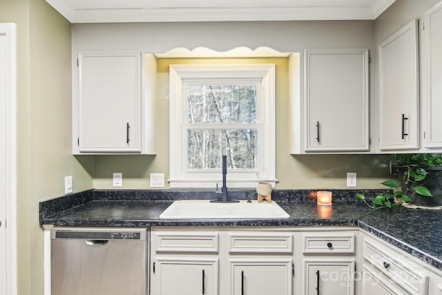 kitchen with sink, stainless steel dishwasher, white cabinets, and dark stone counters