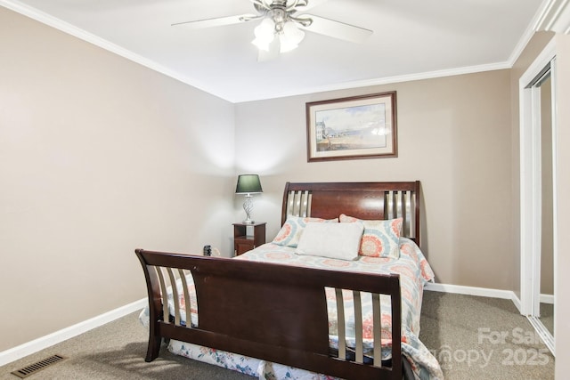 bedroom featuring ornamental molding, carpet floors, and ceiling fan