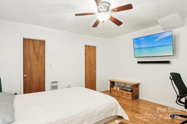 bedroom featuring hardwood / wood-style floors and ceiling fan