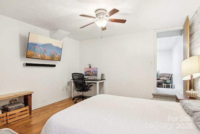 bedroom featuring wood-type flooring and ceiling fan