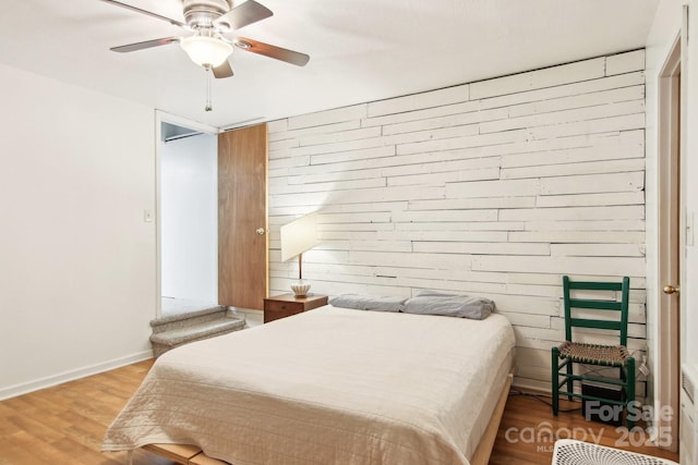 bedroom featuring hardwood / wood-style flooring and ceiling fan