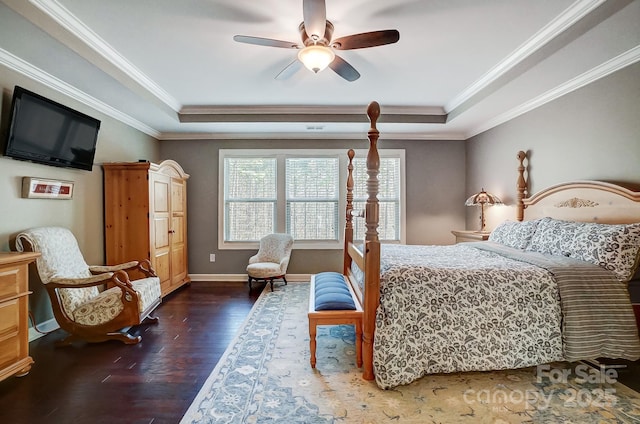 bedroom with dark hardwood / wood-style floors, ornamental molding, a raised ceiling, and ceiling fan