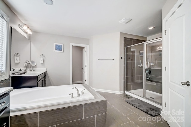 bathroom featuring vanity and plus walk in shower