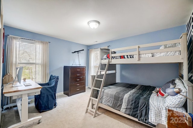 bedroom with light colored carpet