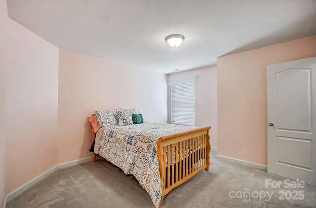 bedroom with light carpet