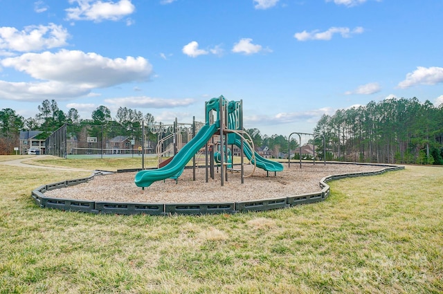 view of jungle gym featuring a lawn