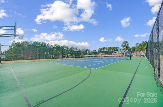 view of sport court with basketball hoop