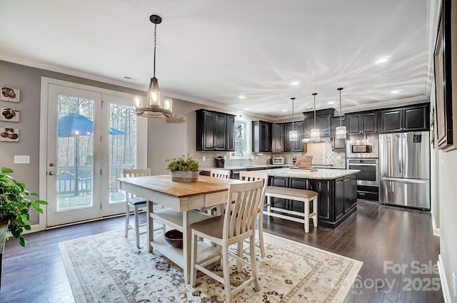 dining area featuring crown molding and dark hardwood / wood-style floors