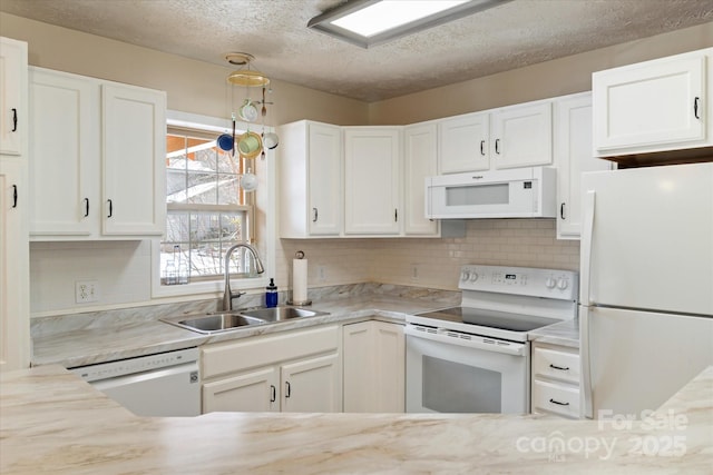 kitchen with sink, white cabinetry, a textured ceiling, white appliances, and backsplash