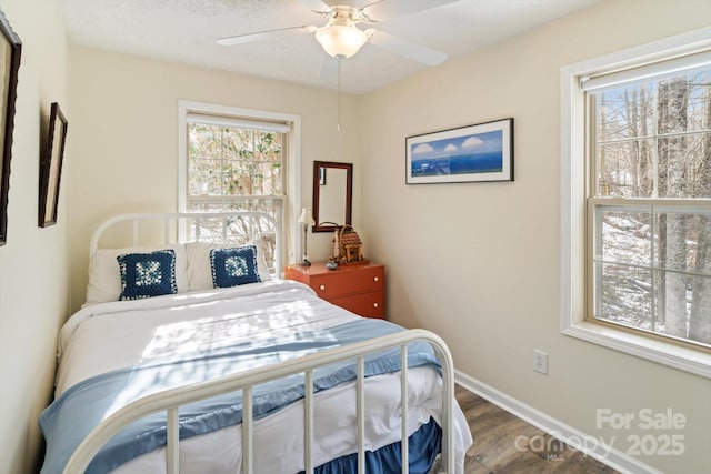 bedroom with hardwood / wood-style flooring and ceiling fan