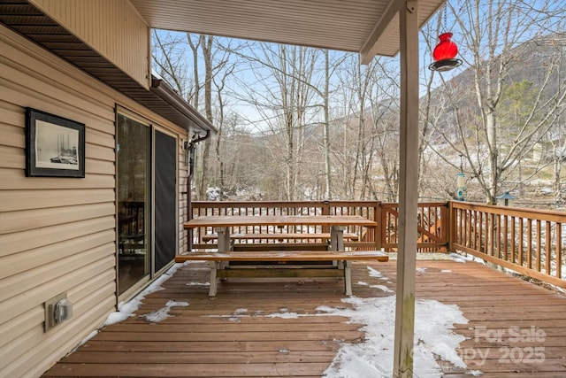 view of snow covered deck