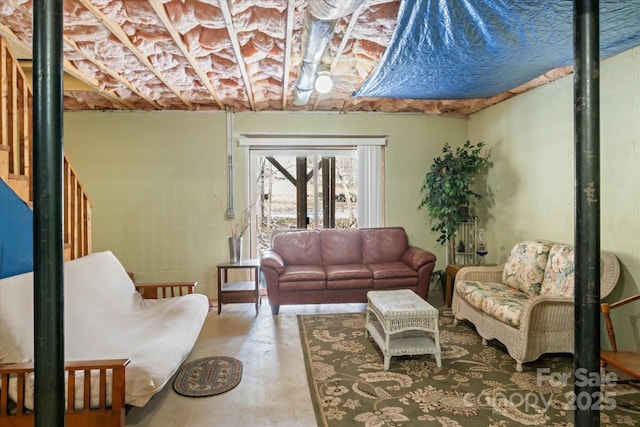 living area featuring concrete flooring