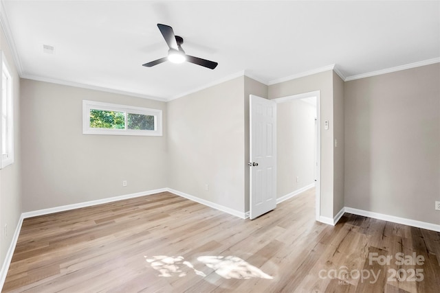 empty room with ceiling fan, ornamental molding, and light wood-type flooring