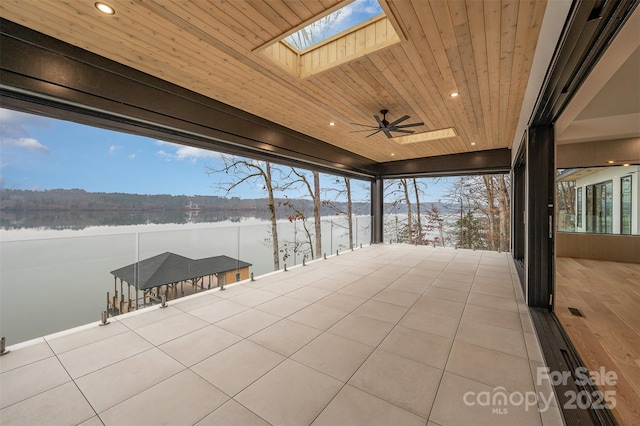 snow covered patio featuring ceiling fan