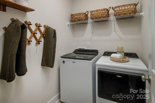 clothes washing area with washer and dryer