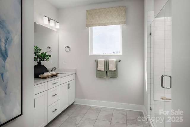 bathroom featuring walk in shower and vanity