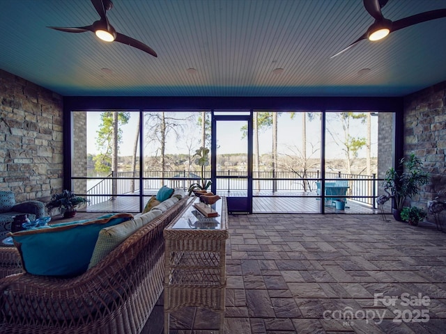 sunroom with wood ceiling, ceiling fan, and plenty of natural light