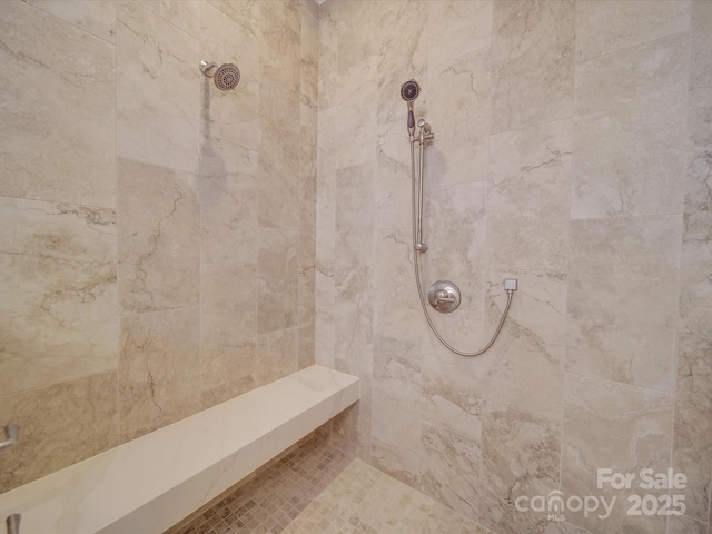 bathroom featuring tiled shower