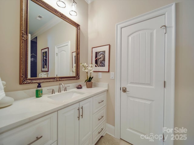 bathroom with vanity and ornamental molding