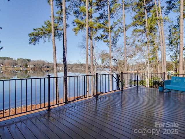 wooden terrace with a water view