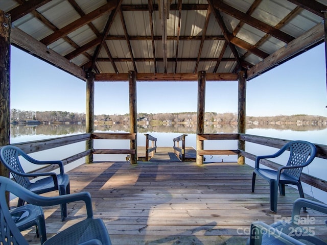 view of dock featuring a gazebo and a water view