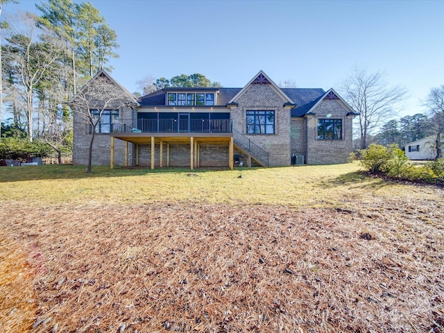 back of house with a yard and a sunroom