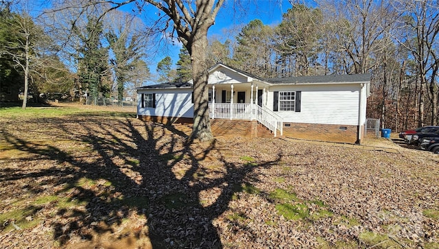 ranch-style house with covered porch