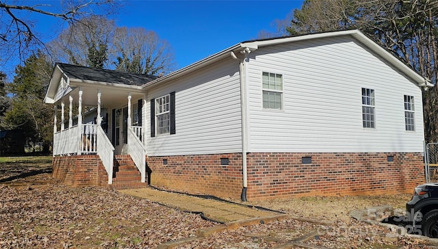 view of property exterior featuring a porch