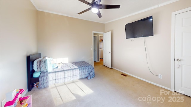 bedroom with crown molding, light colored carpet, and ceiling fan