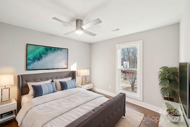 bedroom featuring dark wood-type flooring and ceiling fan