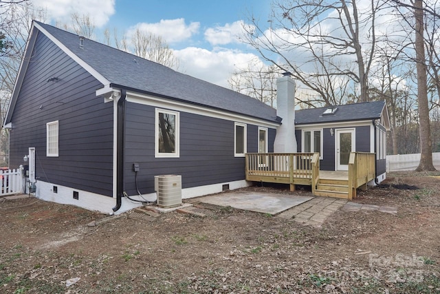 back of house with cooling unit and a deck