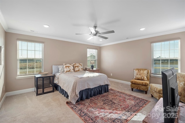 bedroom featuring ornamental molding, light colored carpet, and ceiling fan