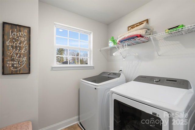 laundry area with washing machine and dryer