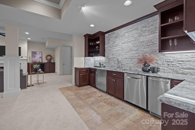 kitchen featuring sink, light stone counters, crown molding, dark brown cabinets, and stainless steel dishwasher