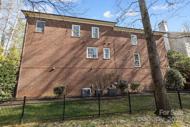 view of building exterior featuring central AC unit