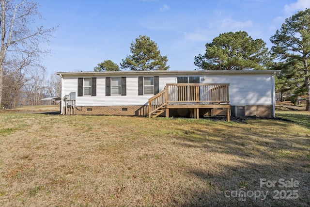 view of front of property with cooling unit, a front yard, and a deck