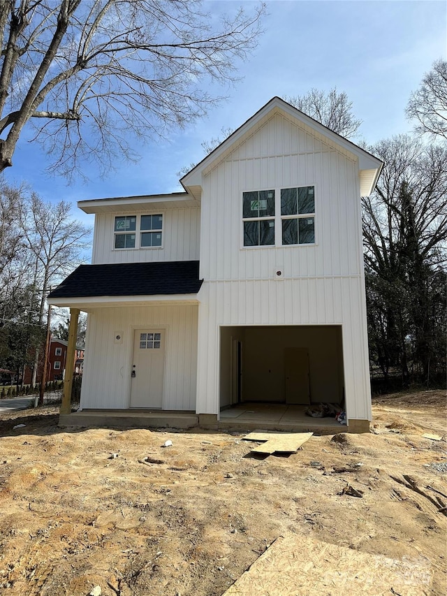 modern farmhouse with an attached garage