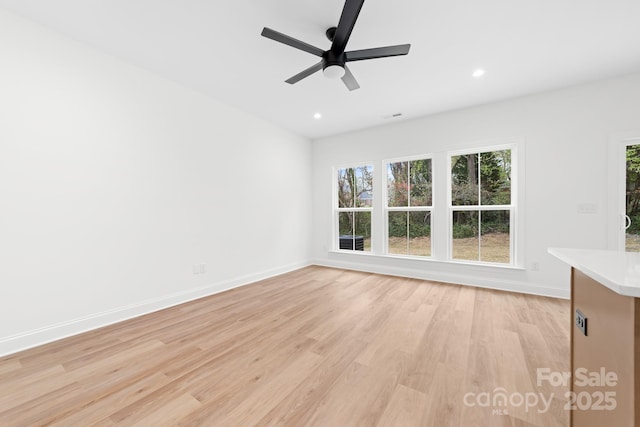 interior space featuring visible vents, light wood-style flooring, baseboards, recessed lighting, and a ceiling fan
