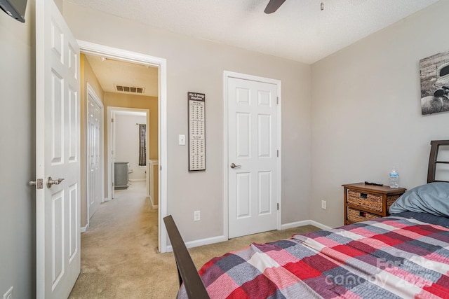 bedroom featuring light colored carpet and ceiling fan