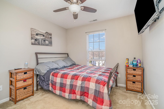 bedroom with light colored carpet and ceiling fan