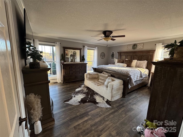 bedroom with crown molding, dark wood-type flooring, ceiling fan, and a textured ceiling