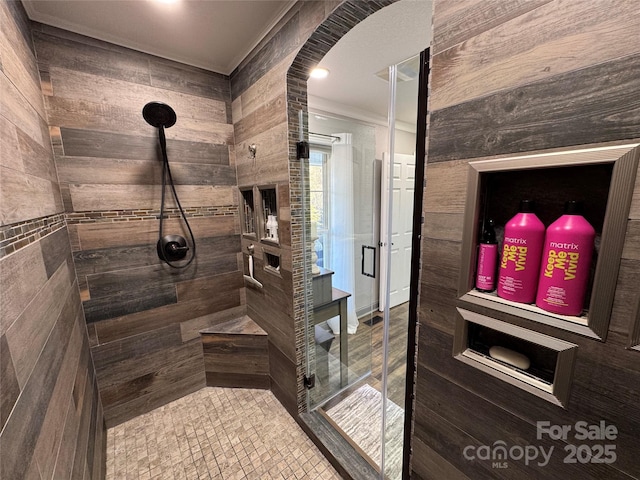 bathroom with a shower with shower door